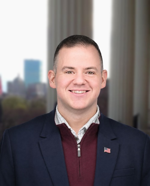 Nate Boudreau on the State House portico in Boston